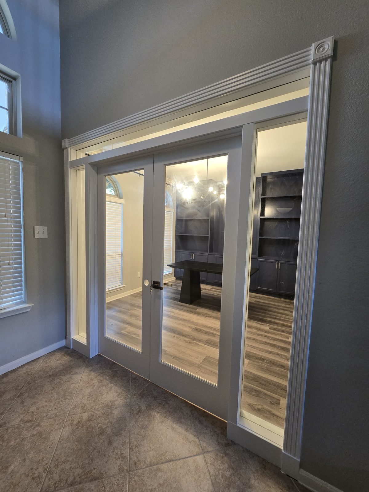 French doors with sidelights and transom installed with finished trim